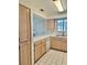 Kitchen with light wood cabinets, appliances and tiled floor at 2725 S Nellis Blvd # 2036, Las Vegas, NV 89121