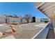 Large backyard with gravel, a metal storage building and mature tree at 303 Glasgow St, Henderson, NV 89015