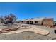 Backyard features flagstone path, firepit, and a shed at 303 Glasgow St, Henderson, NV 89015