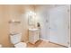 Clean bathroom with white vanity, mirror, and toilet at 303 Glasgow St, Henderson, NV 89015