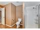 Clean bathroom with shower, toilet and tile floor at 303 Glasgow St, Henderson, NV 89015