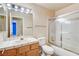 Clean bathroom, includes shower/tub combo and wood vanity at 303 Glasgow St, Henderson, NV 89015