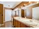 Double vanity bathroom with tiled flooring and a shower at 303 Glasgow St, Henderson, NV 89015