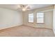 Bedroom with neutral walls, ceiling fan and carpet at 303 Glasgow St, Henderson, NV 89015