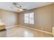 Light and airy dining area with wood flooring and ceiling fan at 303 Glasgow St, Henderson, NV 89015