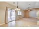 Bright dining area with hardwood floors and access to backyard patio at 303 Glasgow St, Henderson, NV 89015