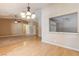 Light and airy dining room with hardwood floors and kitchen views at 303 Glasgow St, Henderson, NV 89015