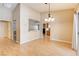 Dining room with hardwood floors and kitchen pass-through at 303 Glasgow St, Henderson, NV 89015