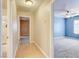 Light-filled hallway with wood flooring, connecting bedrooms at 303 Glasgow St, Henderson, NV 89015