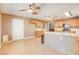 Kitchen with light wood cabinets, stainless steel appliances and breakfast bar at 303 Glasgow St, Henderson, NV 89015