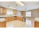 Kitchen with light oak cabinets, stainless steel appliances, and tile countertops at 303 Glasgow St, Henderson, NV 89015