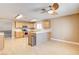 Bright kitchen with light wood cabinets, stainless steel appliances and breakfast bar at 303 Glasgow St, Henderson, NV 89015