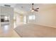 Bright living room with vaulted ceiling, hardwood floors, and a ceiling fan at 303 Glasgow St, Henderson, NV 89015