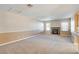 Spacious living room with a stone fireplace and neutral carpet at 303 Glasgow St, Henderson, NV 89015