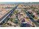 Aerial view of house with pool and solar panels; situated in a residential area near a main road at 328 Hedgehope Dr, Las Vegas, NV 89183