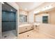 Spa-like bathroom with soaking tub, walk-in shower, and double sinks at 328 Hedgehope Dr, Las Vegas, NV 89183