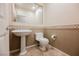 Elegant bathroom with pedestal sink and tiled floor at 328 Hedgehope Dr, Las Vegas, NV 89183