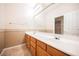 Bathroom with double vanity and wood cabinets at 328 Hedgehope Dr, Las Vegas, NV 89183