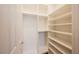 Large walk-in closet with shelving and hanging rods at 328 Hedgehope Dr, Las Vegas, NV 89183