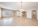 Spacious dining room with hardwood floors and chandelier at 328 Hedgehope Dr, Las Vegas, NV 89183