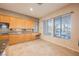 Bright kitchen with wood cabinets, granite countertops and large windows at 328 Hedgehope Dr, Las Vegas, NV 89183