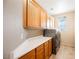 Laundry room with wood cabinets and countertop at 328 Hedgehope Dr, Las Vegas, NV 89183