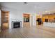 Living room with hardwood floors, fireplace and kitchen access at 328 Hedgehope Dr, Las Vegas, NV 89183