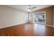 Bright and airy living room with hardwood floors and sliding doors to patio at 328 Hedgehope Dr, Las Vegas, NV 89183