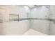 Large walk-in shower with multiple shower heads and stylish tile at 328 Hedgehope Dr, Las Vegas, NV 89183