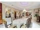 Bright dining room featuring a large table and chandelier at 3495 Pama Ln, Las Vegas, NV 89120