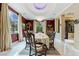 Formal dining room with a large table and marble floors at 3495 Pama Ln, Las Vegas, NV 89120