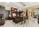 Spacious kitchen with center island and dark wood cabinets at 3495 Pama Ln, Las Vegas, NV 89120