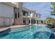 Large freeform pool with a spacious patio at 3495 Pama Ln, Las Vegas, NV 89120