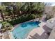 Aerial view of a luxurious pool and landscape at 3495 Pama Ln, Las Vegas, NV 89120