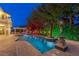 Luxury pool and patio with night lighting at 3495 Pama Ln, Las Vegas, NV 89120