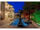 Elegant pool and patio area with night lighting at 3495 Pama Ln, Las Vegas, NV 89120