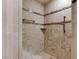 Large shower with neutral tile and marble accents at 3495 Pama Ln, Las Vegas, NV 89120