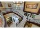 Impressive curved staircase with intricate metalwork and hardwood at 3495 Pama Ln, Las Vegas, NV 89120