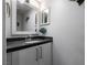 Modern bathroom with gray vanity and a large mirror at 3817 W Red Coach Ave, North Las Vegas, NV 89031