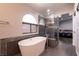 Elegant bathroom featuring a freestanding tub and a walk-in shower at 3817 W Red Coach Ave, North Las Vegas, NV 89031