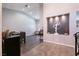 Bright dining area with a wooden table and chairs, hardwood floors at 3817 W Red Coach Ave, North Las Vegas, NV 89031