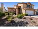 Landscaped front yard with rocks and drought-tolerant plants at 3817 W Red Coach Ave, North Las Vegas, NV 89031