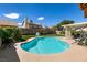 Inviting kidney-shaped pool with ample surrounding space for entertaining at 3817 W Red Coach Ave, North Las Vegas, NV 89031