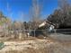 Ranch-style home with attached garage and chain link fence at 3941 Dennis St, Pahrump, NV 89060