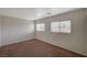 Upstairs bedroom with carpet, neutral walls and large windows at 3968 Moon Tango St, Las Vegas, NV 89129