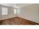 Bright bedroom featuring wood-look floors and a ceiling fan at 3968 Moon Tango St, Las Vegas, NV 89129