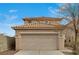 Two-story house with beige siding, attached garage, and a well-maintained front yard at 3968 Moon Tango St, Las Vegas, NV 89129