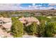 Luxury home on golf course with lake views; expansive property with mature landscaping at 4 Bloomfield Hills Dr, Henderson, NV 89052