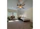 Bedroom with natural light from two windows, ceiling fan, and neutral carpet at 4 Bloomfield Hills Dr, Henderson, NV 89052