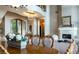 Formal dining room with large table, chandelier, and fireplace at 4 Bloomfield Hills Dr, Henderson, NV 89052